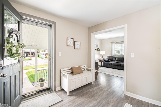 103 Lenawee St, Durand, MI 48429 - entrance foyer with wood finished floors and baseboards