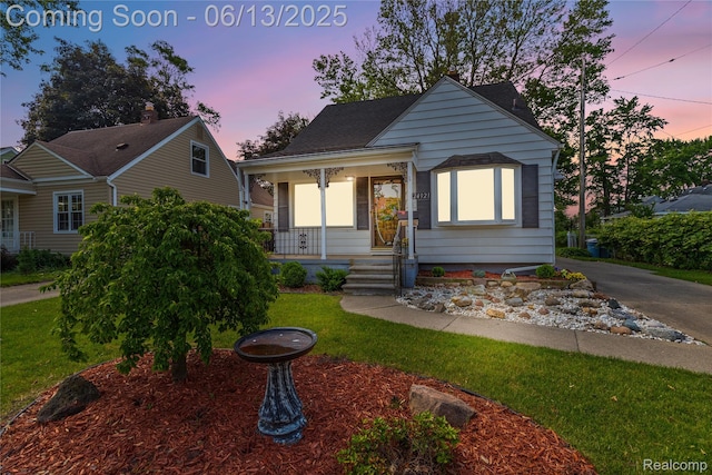 24921 Notre Dame St, Dearborn, MI 48124 - bungalow with a porch and a front lawn