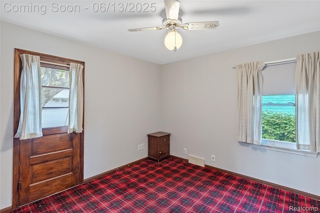 24921 Notre Dame St, Dearborn, MI 48124 - unfurnished room with plenty of natural light, a ceiling fan, and dark colored carpet