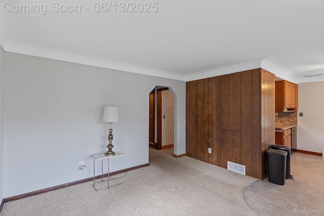 24921 Notre Dame St, Dearborn, MI 48124 - spare room with arched walkways and light colored carpet