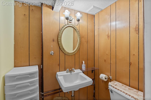 24921 Notre Dame St, Dearborn, MI 48124 - bathroom with toilet and wooden walls