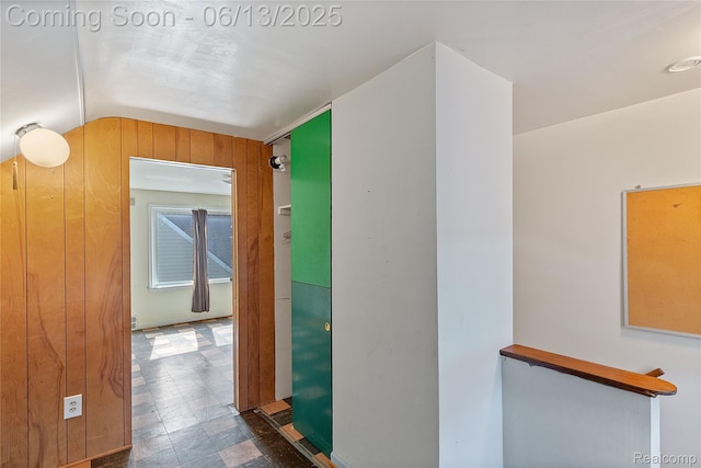 24921 Notre Dame St, Dearborn, MI 48124 - hallway with vaulted ceiling, tile patterned floors, and wooden walls