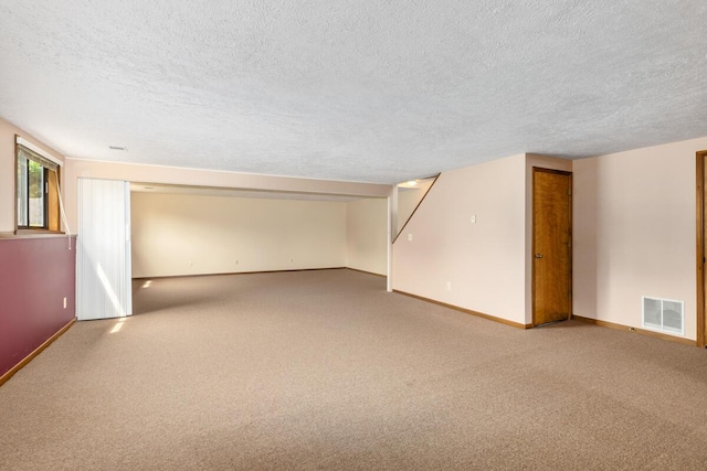 5157 Cliff Ct Unit 54, Hudsonville, MI 49426 - basement with a textured ceiling, carpet floors, and baseboards