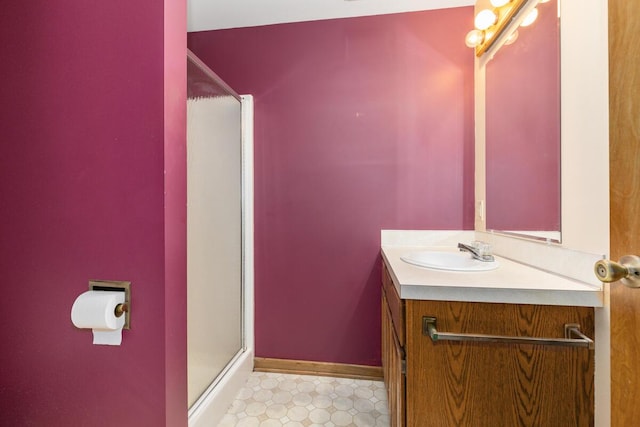5157 Cliff Ct Unit 54, Hudsonville, MI 49426 - full bathroom with vanity, a stall shower, baseboards, and tile patterned floors