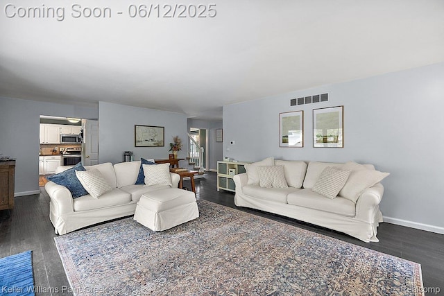 46341 Jasmine Ct, Chesterfield, MI 48047 - living room featuring dark wood-type flooring and baseboards