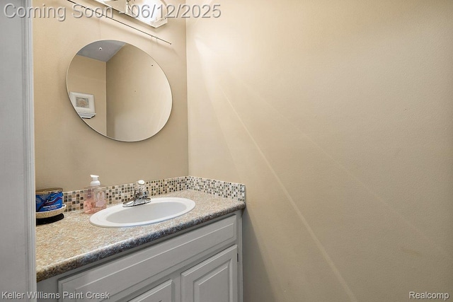 46341 Jasmine Ct, Chesterfield, MI 48047 - bathroom with vanity and decorative backsplash