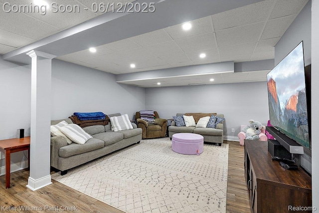 46341 Jasmine Ct, Chesterfield, MI 48047 - living area with wood finished floors, a paneled ceiling, and recessed lighting