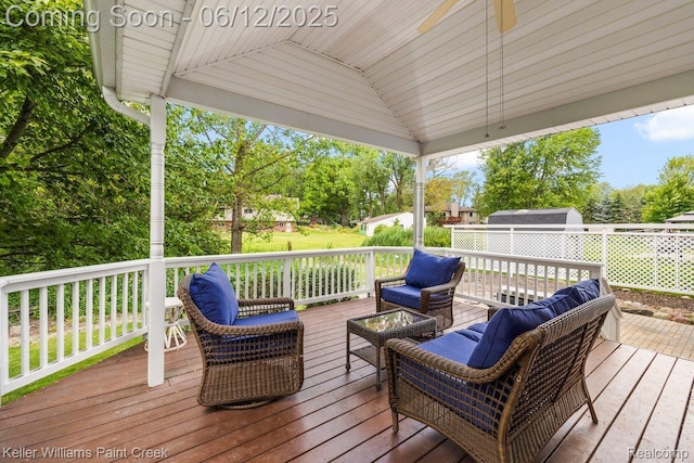 46341 Jasmine Ct, Chesterfield, MI 48047 - deck featuring an outdoor hangout area, ceiling fan, and a storage shed