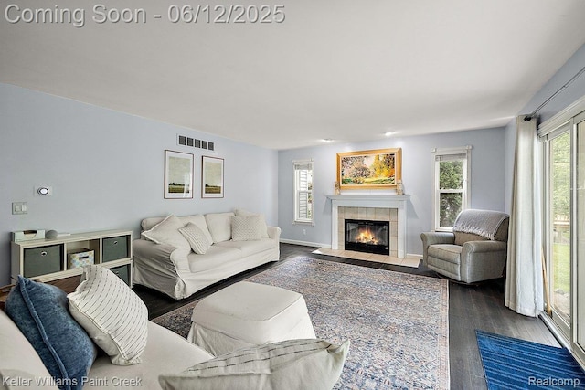 46341 Jasmine Ct, Chesterfield, MI 48047 - living room featuring dark wood finished floors and a fireplace