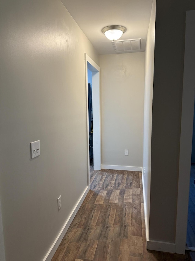 4223 S Harvard Ave, Baldwin, MI 49304 - hall featuring dark wood-style flooring and baseboards