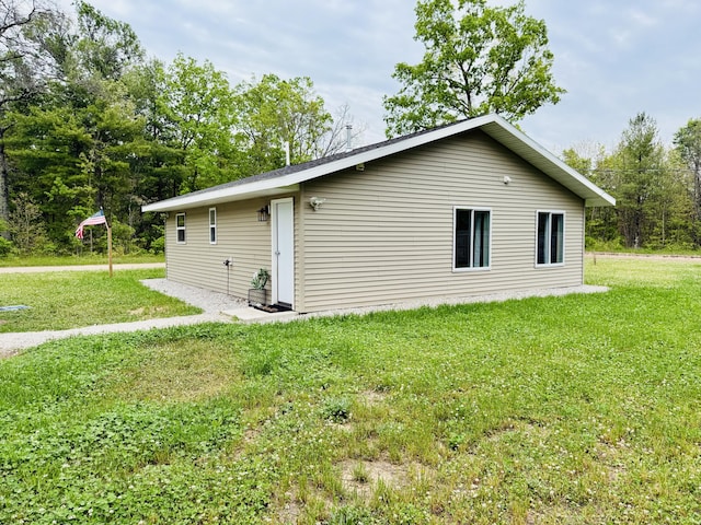 4223 S Harvard Ave, Baldwin, MI 49304 - view of side of home with a yard