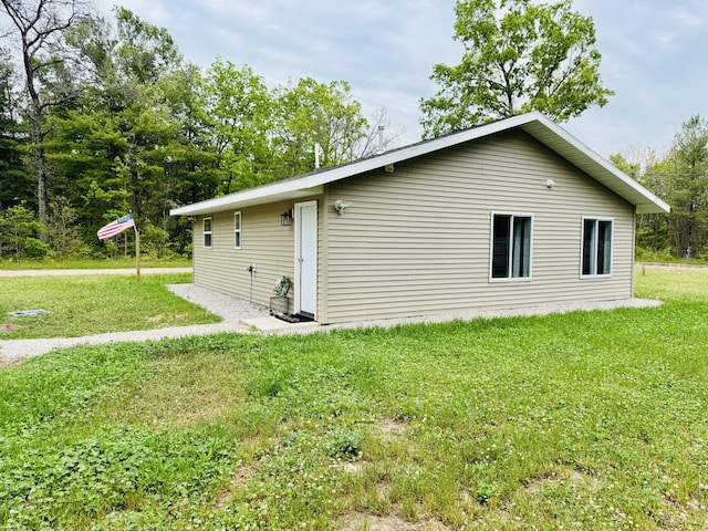 4223 S Harvard Ave, Baldwin, MI 49304 - view of home's exterior featuring a yard