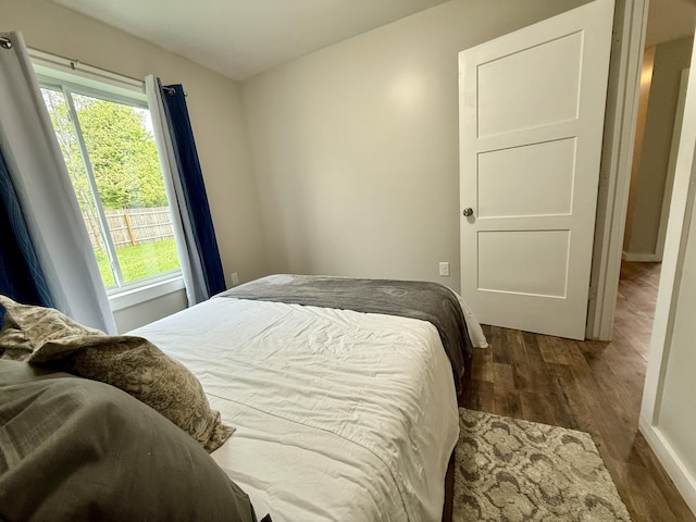 4223 S Harvard Ave, Baldwin, MI 49304 - bedroom with dark wood finished floors and baseboards