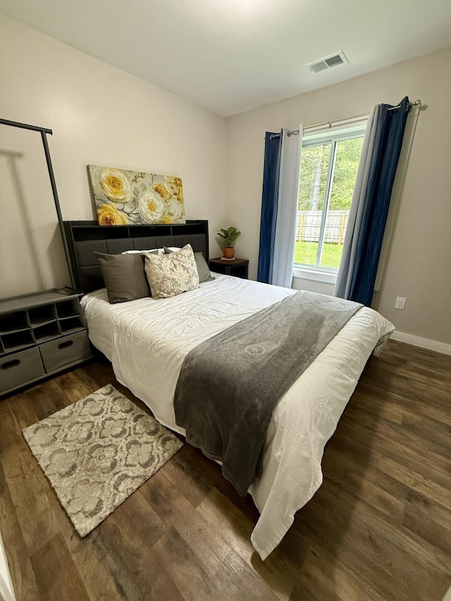 4223 S Harvard Ave, Baldwin, MI 49304 - bedroom with wood finished floors and baseboards
