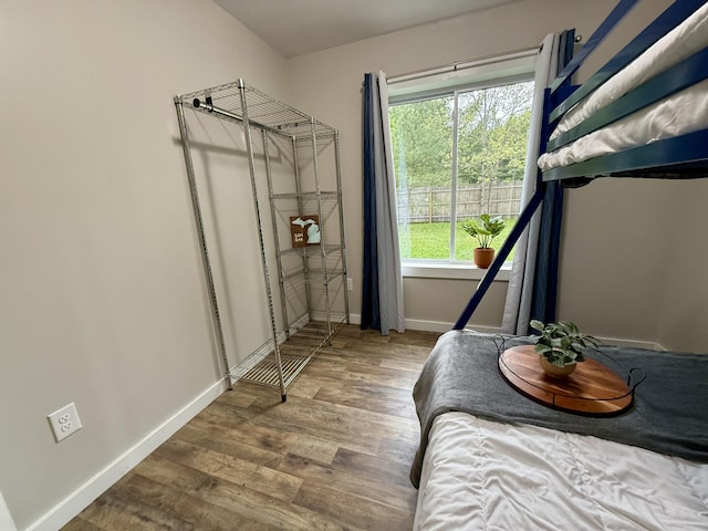 4223 S Harvard Ave, Baldwin, MI 49304 - bedroom with baseboards and wood finished floors
