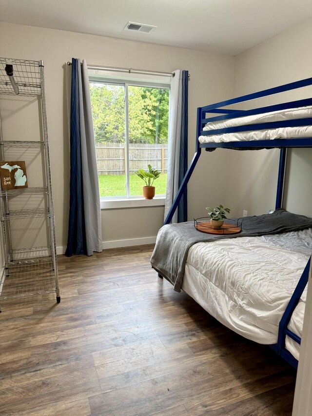 4223 S Harvard Ave, Baldwin, MI 49304 - bedroom featuring wood finished floors and baseboards