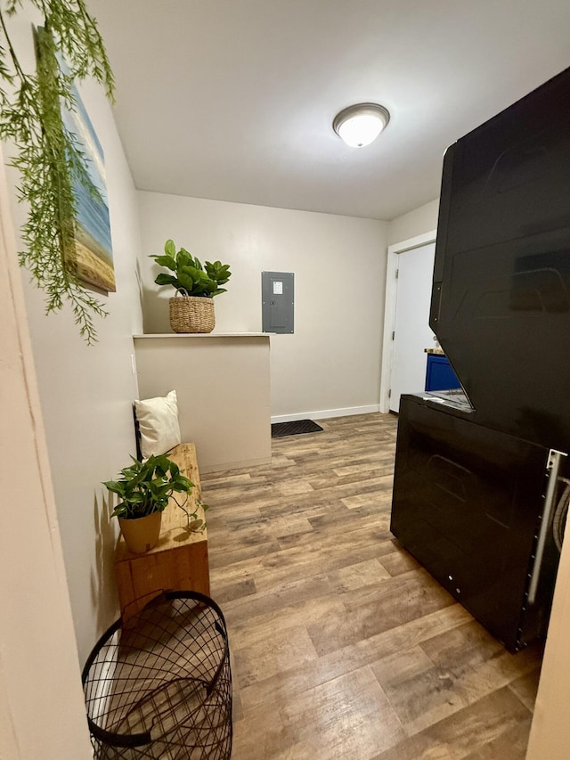 4223 S Harvard Ave, Baldwin, MI 49304 - hallway featuring electric panel, wood finished floors, and baseboards