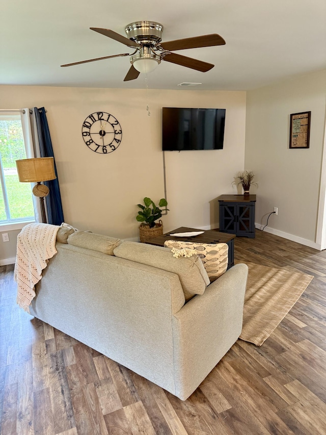4223 S Harvard Ave, Baldwin, MI 49304 - living area with a ceiling fan, baseboards, and wood finished floors