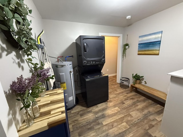 4223 S Harvard Ave, Baldwin, MI 49304 - office with stacked washer / dryer, water heater, wood finished floors, and baseboards