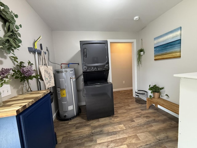 4223 S Harvard Ave, Baldwin, MI 49304 - washroom with water heater, stacked washer / drying machine, wood finished floors, and baseboards
