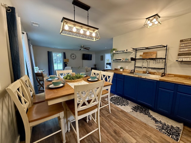 4223 S Harvard Ave, Baldwin, MI 49304 - dining area featuring wood finished floors and a ceiling fan