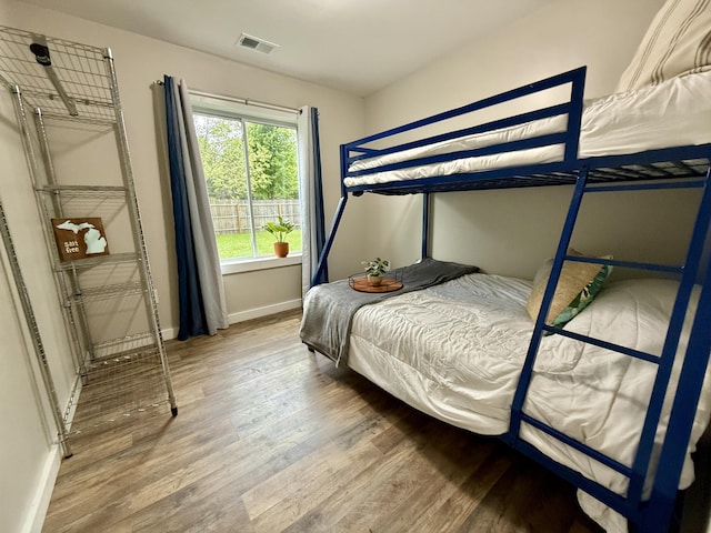 4223 S Harvard Ave, Baldwin, MI 49304 - bedroom featuring wood finished floors and baseboards