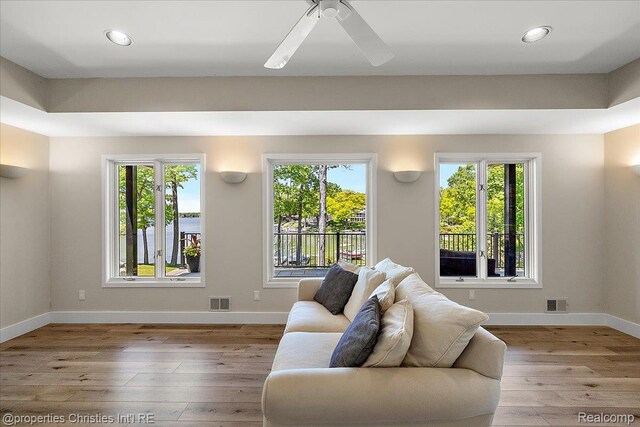 1739 Ridge Rd, White Lake, MI 48383 - living room with hardwood / wood-style floors, healthy amount of natural light, a ceiling fan, and recessed lighting