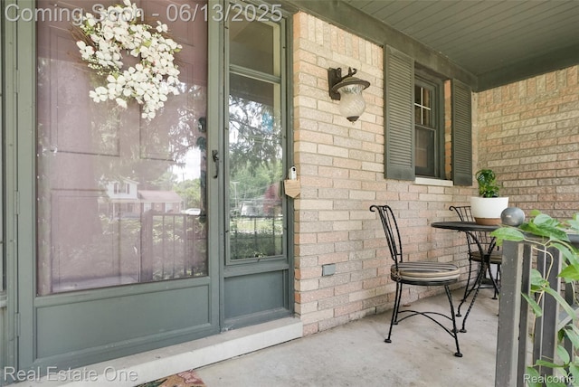23229 Gilbar St, Novi, MI 48375 - doorway to property featuring a porch and brick siding