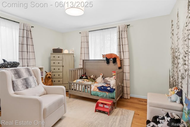 23229 Gilbar St, Novi, MI 48375 - bedroom featuring wood finished floors and baseboards
