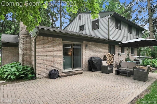 23229 Gilbar St, Novi, MI 48375 - back of property with an outdoor hangout area, a patio area, and brick siding