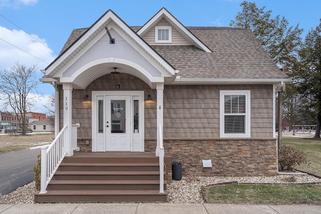 119 E Eliza St, Schoolcraft, MI 49087 - view of front facade with stone siding and roof with shingles