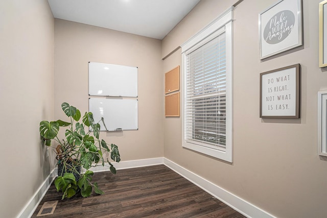 119 E Eliza St, Schoolcraft, MI 49087 - corridor featuring baseboards and dark wood-style floors