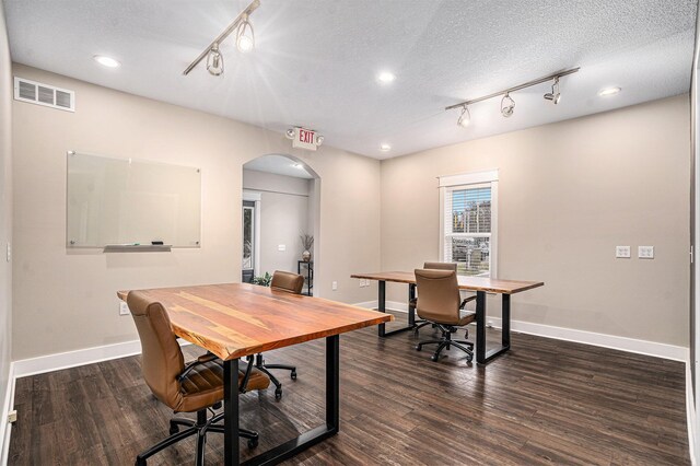 119 E Eliza St, Schoolcraft, MI 49087 - office space with rail lighting, arched walkways, baseboards, dark wood-type flooring, and recessed lighting