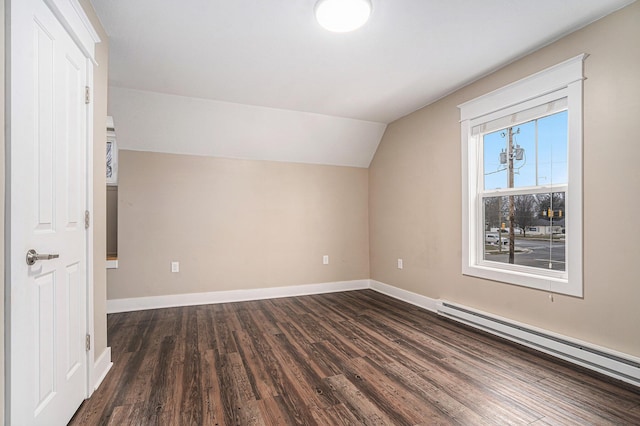 119 E Eliza St, Schoolcraft, MI 49087 - additional living space with a baseboard heating unit, lofted ceiling, dark wood-type flooring, and baseboards