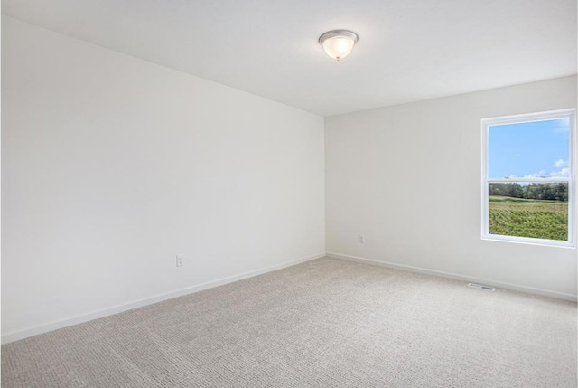 5978 Boxthorn Trl, Kalamazoo, MI 49009 - spare room with light colored carpet and baseboards