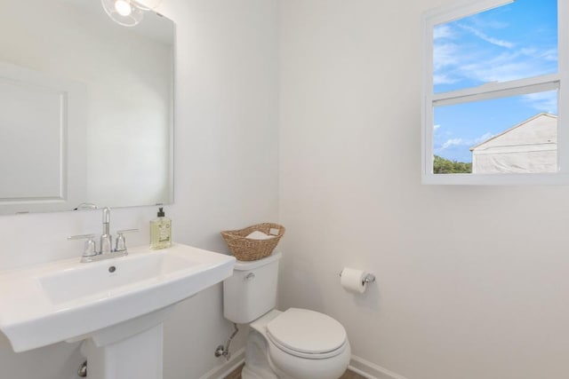 5978 Boxthorn Trl, Kalamazoo, MI 49009 - bathroom featuring baseboards and toilet