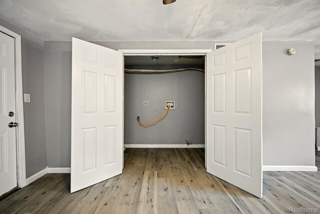 2070 Harwine St, Flint, MI 48532 - laundry area with hookup for a washing machine and wood finished floors