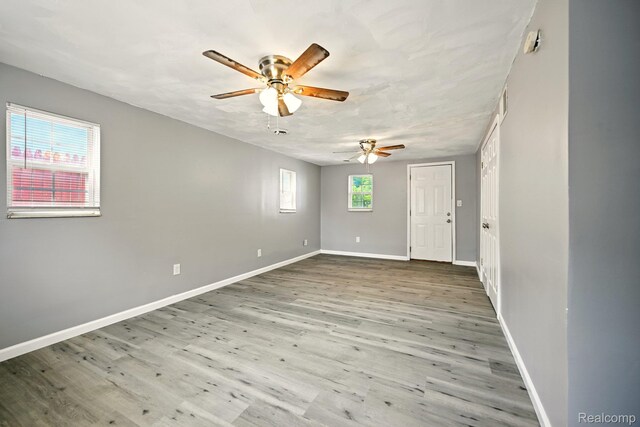 2070 Harwine St, Flint, MI 48532 - unfurnished room featuring ceiling fan and wood finished floors