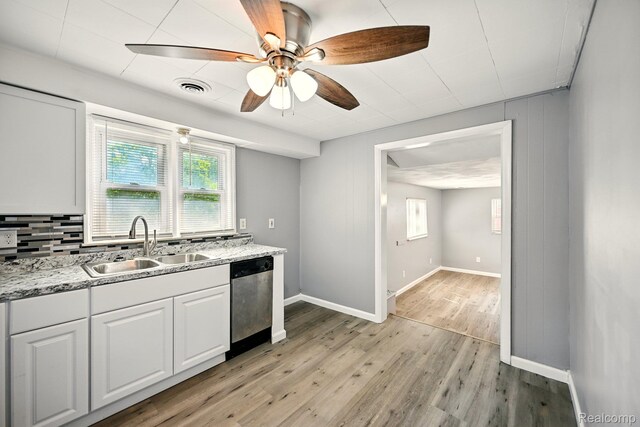 2070 Harwine St, Flint, MI 48532 - kitchen featuring dishwasher, healthy amount of natural light, light wood-style floors, and ceiling fan
