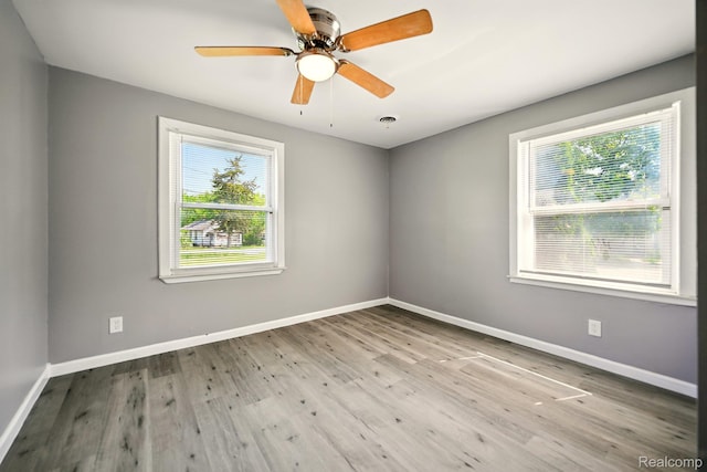 2070 Harwine St, Flint, MI 48532 - empty room featuring wood finished floors and ceiling fan