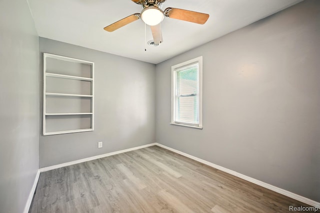 2070 Harwine St, Flint, MI 48532 - empty room featuring wood finished floors and a ceiling fan