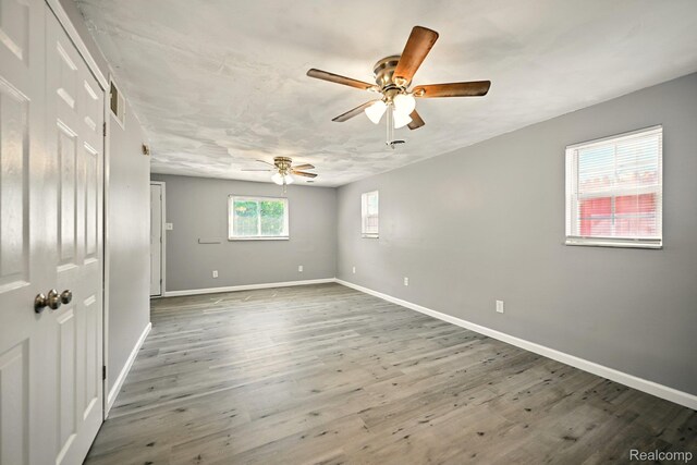 2070 Harwine St, Flint, MI 48532 - unfurnished room with ceiling fan and wood finished floors