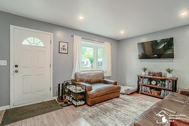 14711 Oldham St, Taylor, MI 48180 - living area with wood finished floors, baseboards, and recessed lighting