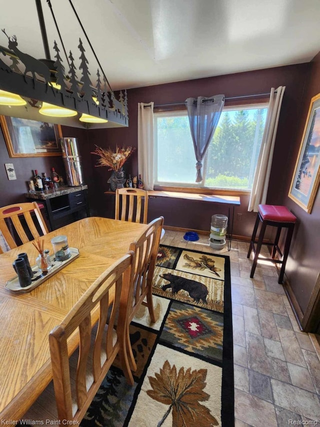 370 Wales Ridge Rd, Wales, MI 48027 - dining space with stone tile floors and baseboards