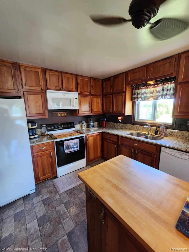370 Wales Ridge Rd, Wales, MI 48027 - kitchen with white appliances, butcher block countertops, a ceiling fan, dark stone finish floors, and brown cabinets