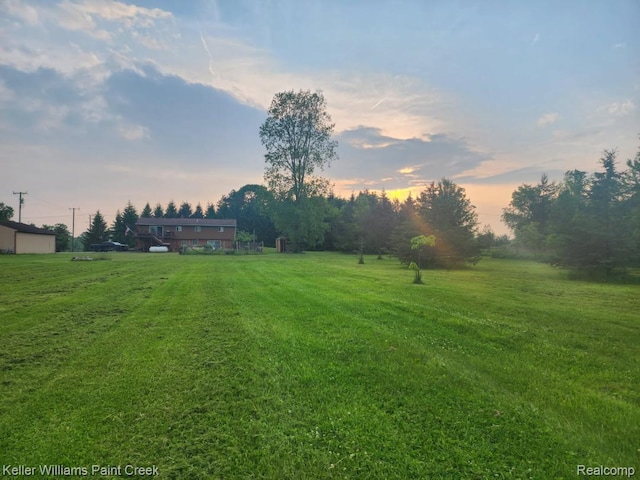 370 Wales Ridge Rd, Wales, MI 48027 - yard at dusk with a lawn and a rural view