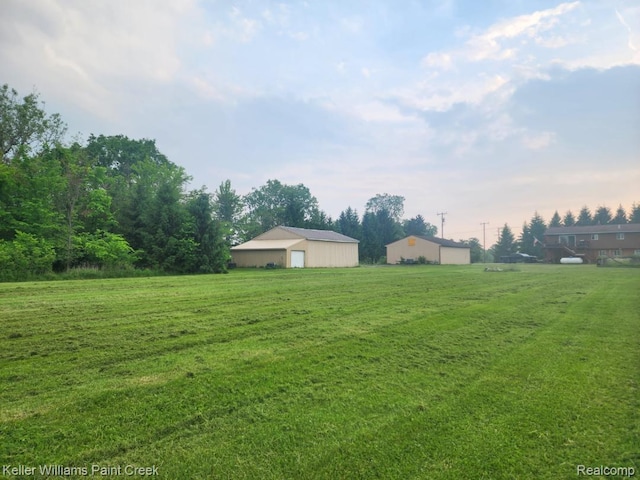 370 Wales Ridge Rd, Wales, MI 48027 - view of grassy yard with a pole building and an outdoor structure