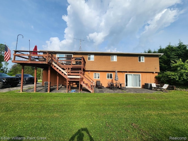 370 Wales Ridge Rd, Wales, MI 48027 - back of house featuring stairway, a lawn, a wooden deck, and a patio area