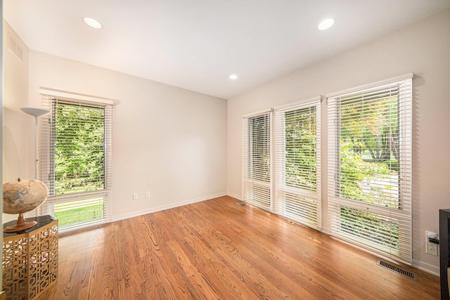 2002 Valleyview Dr, Ann Arbor, MI 48105 - spare room featuring healthy amount of natural light, baseboards, wood finished floors, and recessed lighting