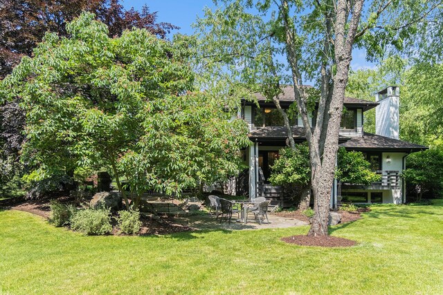2002 Valleyview Dr, Ann Arbor, MI 48105 - view of grassy yard with a patio